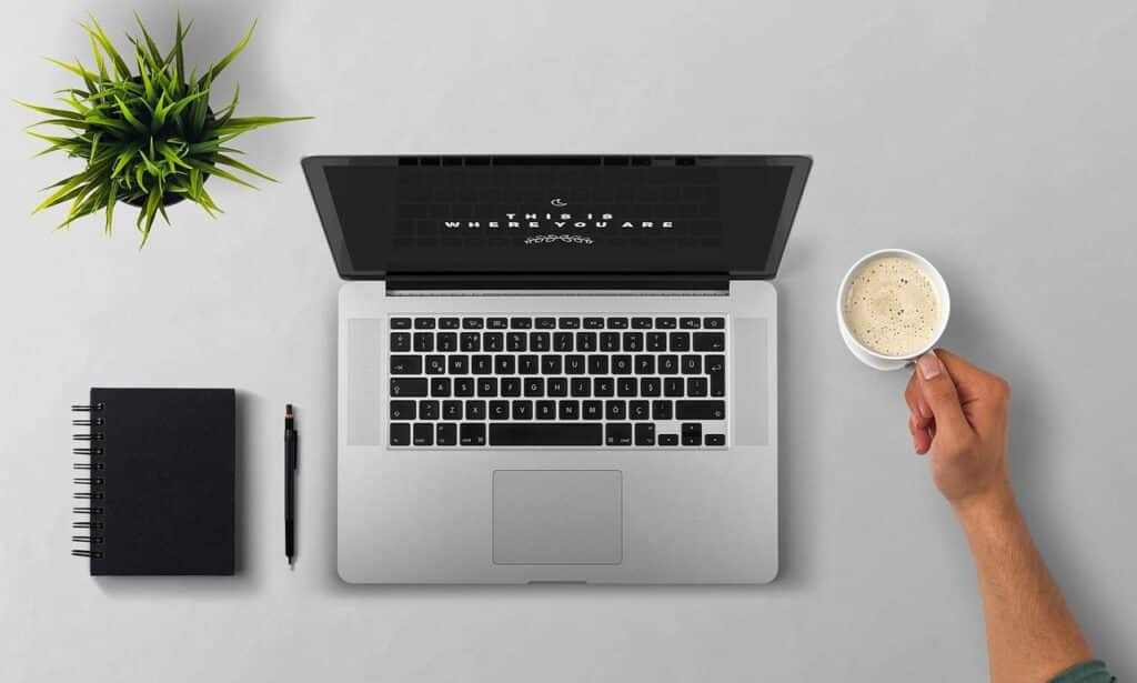 Laptop, coffee, arm